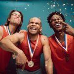 confetti falling on proud basketball players wearing medals